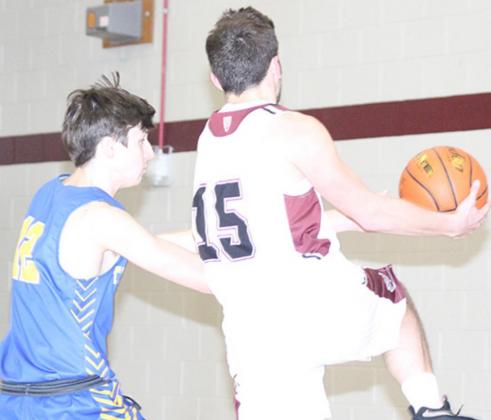 LHS’ Brady Bledsaw (#15, right) gets his hands on steal and just misses a fast break layup in the 2nd half. Paula Jasa/Republican