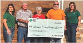 Presenting/Receiving the check, Farm Credit Representative, April McHenry; Steinauer Fireman, Terry Wenzl; Steinauer Community Foundation Board Member, Marie Schmit; Steinauer Fireman, Byford Schmit; Farm Credit Representative, Jessi Larson.