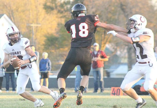 P.C.’s Hunter Johnson (#18, center) disrupts Stuart’s backfield in the first half of the D6 State playoff game. Pawnee City defeated the Broncos by a huge 64-8 margin. Paula Jasa/Republican