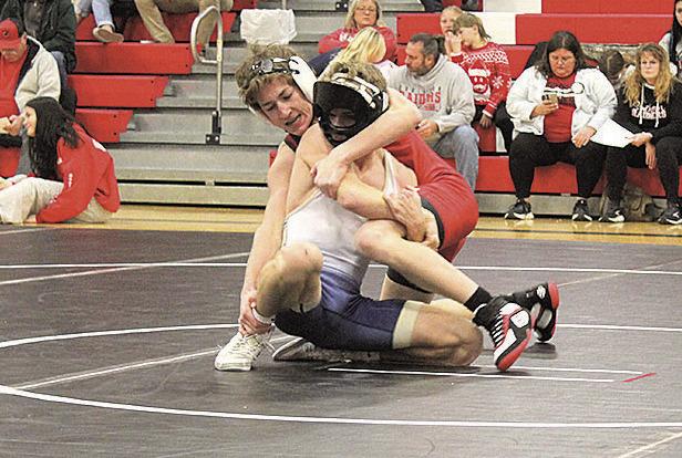 Pawnee City Indian Luke Hunzeker battles against Lincoln Lutheran Warrior Skylar Springer.