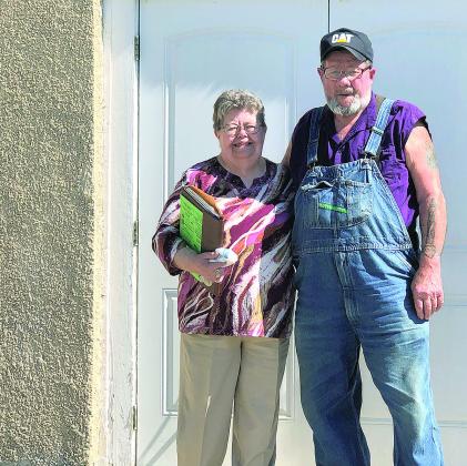 Mary and Norman Barker stand at the front door of the ZCBJ Hall in DuBois. Restoration of the Hall was a labor of love for the couple,