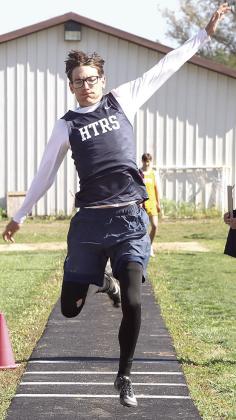 HTRS’ Kiffen Hunzeker flies through the air in the boys’ Triple Jump event where he took the silver medal. Paula Jasa/Republican
