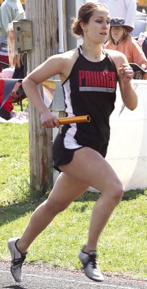 P.C.’s Logan Maloley carries the baton on her first leg of the girls’ 3200 M. Relay at the Pioneer Meet. Paula Jasa/Republican