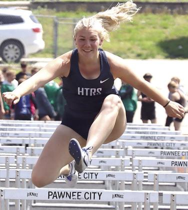 HTRS’ Elie Bstandig clears one of her final hurdles of the girls’ 100 M. prelims at the Pioneer Conference. Paula Jasa/Republican