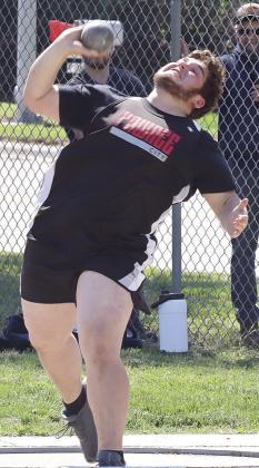 Pawnee City’s Mason Fisher gives his all in the boys’ Pioneer Conference Shot Put event. Paula Jasa/Republican