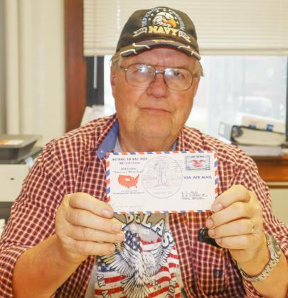 Larry Bradbury holds up his 1938 Airmail stamped letter which has a stamp of the Pawnee County Fair, known then as The Little State Fair. Ray Kappel/Republican