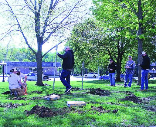 Volunteers Install New Flag Poles On Courthouse Lawn