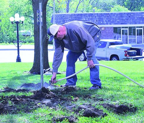 Volunteers Install New Flag Poles On Courthouse Lawn