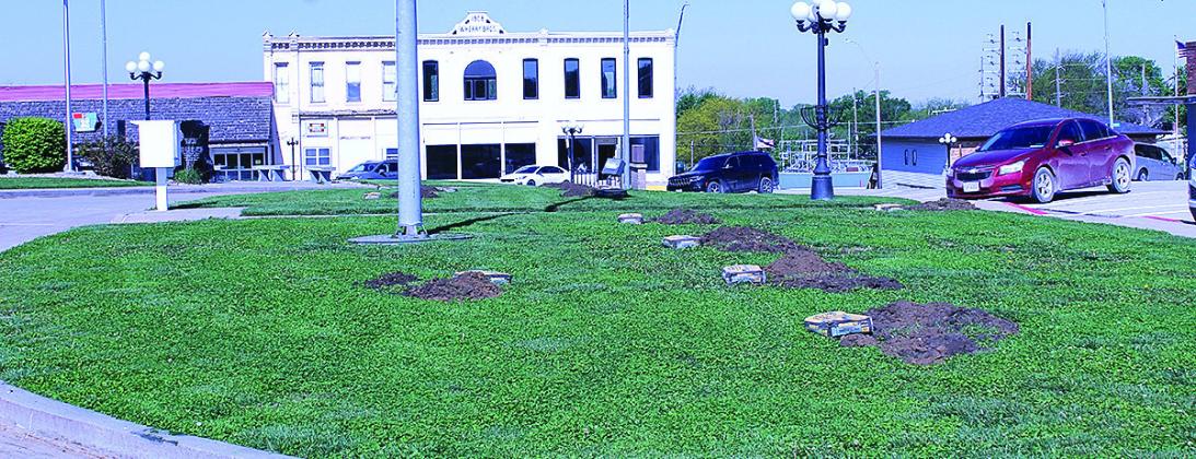 Volunteers Install New Flag Poles On Courthouse Lawn