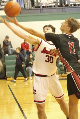P.C.’s Jett Farwell (#30, left) battles a Wymore-Southern player for a loose ball out of bounds. Farwell scored 32 points against W-S in their 3rd place Championship. Paula Jasa/Republican