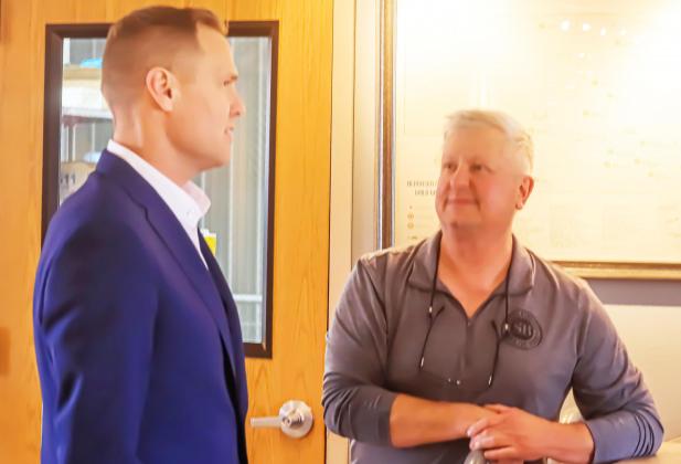 Republican candidate for Governor Brett Lindstrom chats with Mike Schilling at SchillingBridge Winery and Microbrewery last Wednesday. He spoke to a small crowd on a campaign stop here. Ray Kappel/Republican