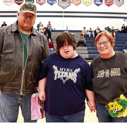 HTRS’ Kellee Snethen (center) pictured with her parents Russ and Roxie Snethen was honored on Parent’s Night for her participation in Unified Bowling this year. Photo courtesy of Lorrie Novak