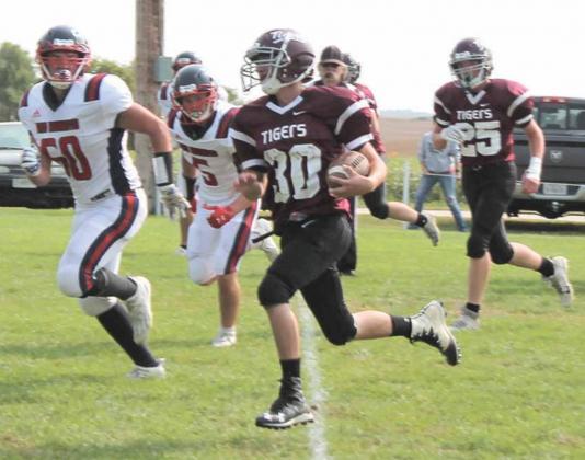 LHS’ David McKay (#30) takes off on a huge run against Heartland Lutheran in Friday afternoon’s game while teammate Tristan Ray (#25) follows close behind. John Sterup/Republican