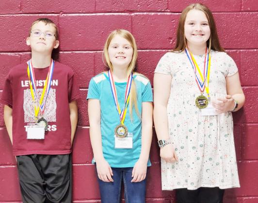 3rd/4th Grade Division: (l to r) Landon Rohmeyer, Lewiston, 2nd place, Abigail Johnson, Pawnee City, 3rd place, Chloe Bogues, Lewiston, 1st place