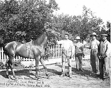 Above: Bill Frank, holds his thoroughbred race horse Viola Roberts in this undated photo. He was one of a series of owners of the building during the lost years between the use of the building as a livery stable and as a vehicle repair shop. Perhaps he used the barn to hold her and others, as well as horses he treated as a veterinarian.