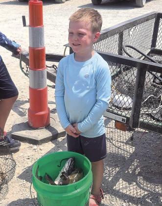 First Place winner for ages 2-9, Oliver Rauner and his winning bucket of fish.