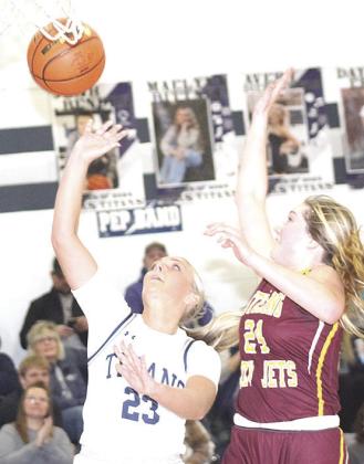 HTRS’ Jaylie McNealy (#23, left) goes up for an easy shot against a Sterling defender in Friday night’s game. Paula Jasa/Republican