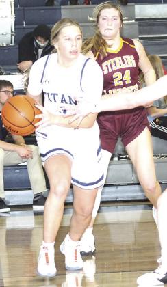 HTRS’ Laramie Glathar (#3, left) drives the baseline against Sterling on Friday night. Paula Jasa/Republican