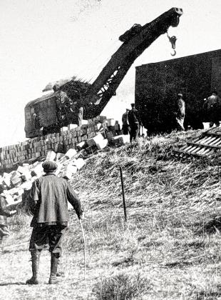 One of the train wreck photos from Dorie Gebhard. It shows a “wrecking crane” on a flat car. Two cranes cleared the site, starting from opposite ends. Enough wreckage of the 6 am wreck was cleared by 5 pm to allow passenger trains to get through. To see the other photographs, go to TableRockHistoricalSociety. com and search “1928 train wreck.”