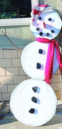The Missing Sock Snowman stood in for real snow during the Christmas season in Pawnee City, but after he was taken down and put away for another year Old Man Winter brought us some real snow. With school canceled Monday and Tuesday the snow was nice and wet, perfect for children to make snowmen and for that matter. snowballs.