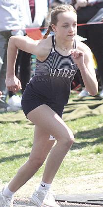 Paula Jasa/Republican HTRS’ Grayson Sherman takes off in the girls’ 3200 M. run. Sherman claimed gold with a time of 13:27.79.
