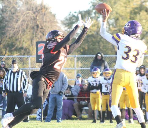 P.C.’s Trey Marteney (#21, left) was in the Warriors’ backfield numerous times during the game. After changing his torn jersey from #26 to #21, he recorded a total of 7 tackles, had 1 catch for 52 yards and had one fumble recovery. Paula Jasa/Republican
