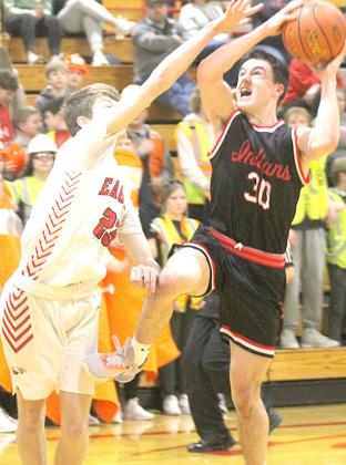 P.C.’s Jett Farwell (#30, right) drives the paint against a defender on his way to scoring 14 points with 5 rebounds, 3 assists and 2 steals. Paula Jasa/Republican
