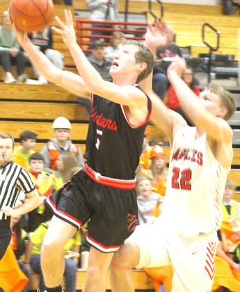 P.C.’s Justin Pierce (#5, left) picks up a steal and goes in for a layup attempt against Johnson-Brock. Paula Jasa/Republican