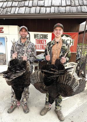 Everett Bender (left) and his son Zachary (right) are the leaders in the Adult Division
