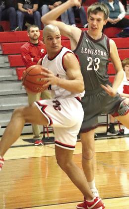 Paula Jasa/Republican P.C.’s Atreyu Kling (left) brings down a rebound against LHS’ Ashton Sanders (#23, right).