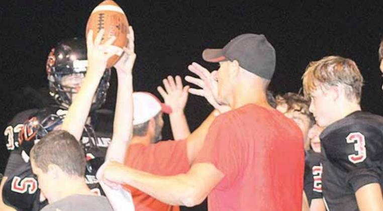Holding up the game ball after a well-deserved win! Paula Jasa/Republican