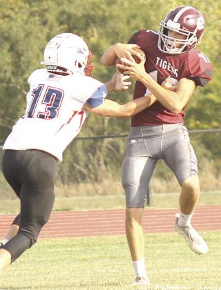LHS’ Ashton Sanders (#12, right) goes up for a great grab against Parkview late in the game on Friday. Sanders had 3 catches for 58 yards in the victory over Parkview. Paula Jasa/Republican