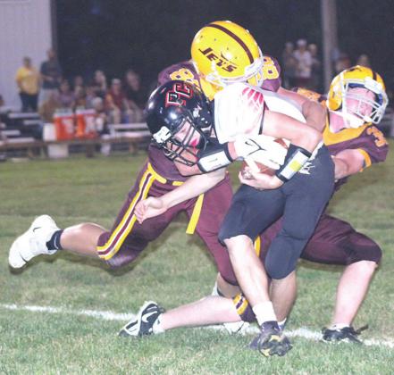 Pawnee City’s Jett Farwell (center) draws a crowd on one of his catches in Friday night’s game against Sterling. Pawnee City lost by just ten points, 28-38. Paula Jasa/Republican