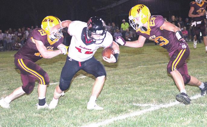 Pawnee City’s Andy Maloley (#12, center) picks up a big first down on a 4th down pass play late in the game. Paula Jasa/Republican