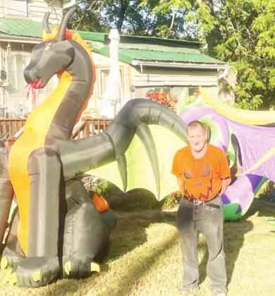 Chuck posing with his locally famous Halloween Decor.