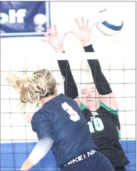 HTRS’ Macy Vrtiska (#3) drills a spike past a FCSH defender in Thursday night’s Championship game. Paula Jasa/Republican