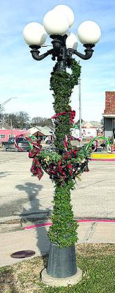 2nd place goes to Tyra and Dan Ott for their festive candy cane bedecked lamppost