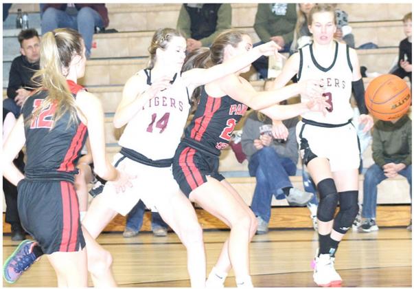 LHS’ Meagan Sanders (#14, left) goes up against P.C.’s Madison Lytle (#23) for a loose ball as P.C.’s Mallory Branek (#12, left) and LHS’ Katelyn Sanders (#3, right) look on. Paula Jasa/Republican