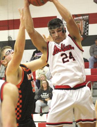 P.C.’s Atreyu Kling pulls in a strong rebound against the Griffins. Kling had 7 rebounds in the game. Paula Jasa/Republican