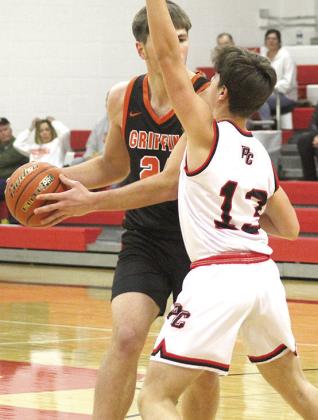 P.C.’s Tyler Tegtmeier (#13, right) plays tough defense up top against the Griffins’ top scorer. Paula Jasa/Republican