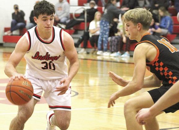 P.C.’s Jett Farwell (#30, left) looks to drive past Diller/Odell in Thursday night’s season opening win. Farwell scored 14 points in the P.C. triumph. Paula Jasa/Republican