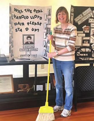 Marica Borcher cleaning at the Harold Lloyd Museum.