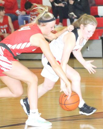 P.C.’s Cara Pierce (right) picks up a steal against Weeping Water. Paula Jasa/Republican