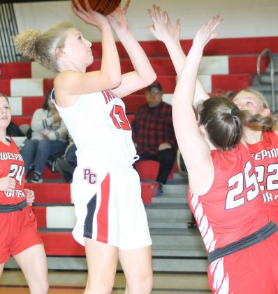 P.C.’s Maddy Osborne (#13) splits the Weeping Water defense for a bucket. Paula Jasa/Republican