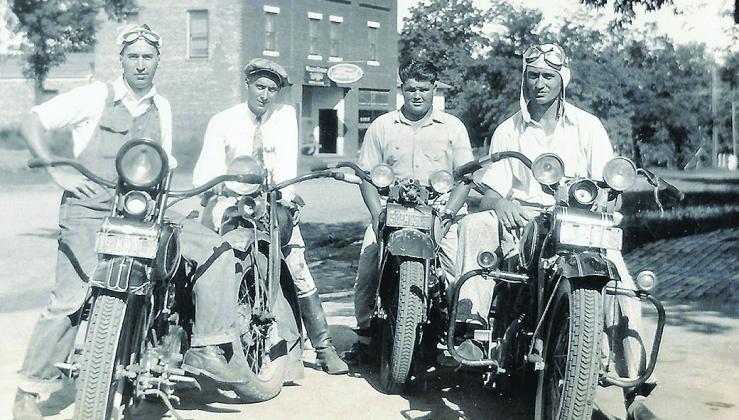 Old Karas Ford garage in the background. Inset is Rudy Karas.