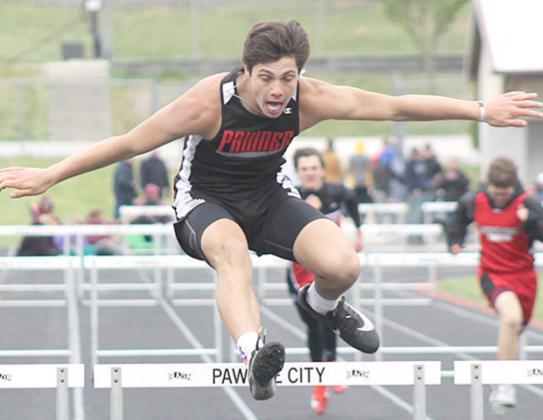 P.C.’s Anthony Kling clears his final hurdle in the 300 M. Hurdle event clocked at 48.56. Paula Jasa/Republican