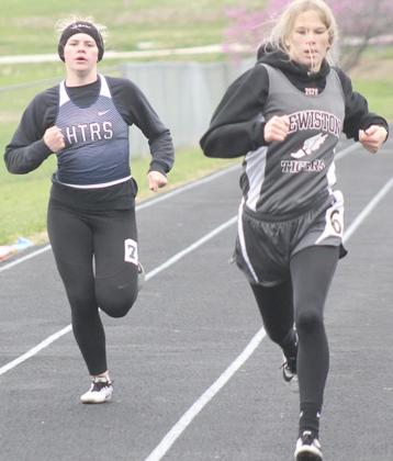LHS’ Meagan Sanders (right) and HTRS’ Aly Howe (left) finish strong in the 200 M. Dash prelims. Paula Jasa/Republican