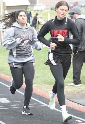 P.C.’s Mallory Branek (front) leads LHS’ Nayla Alos in the girls’ 1600 M. run. Branek and Alos finished 5th, 6th. Paula Jasa/Republican
