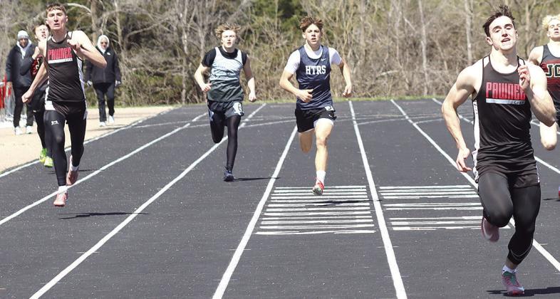 Pawnee City’s Jett Farwell (right) crosses the line first in the boys’ 400 M. Dash at 53.11 while teammate Drew Menninga (left) claims 2nd place at 55.62. HTRS’ Kameon Dettmann (center) placed 4th with a time of 55.90. Paula Jasa/Republican
