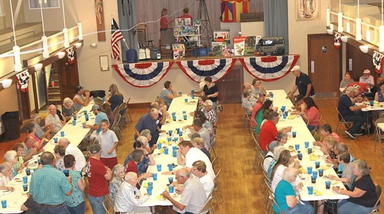 The Bank of Steinauer Celebration brought quite a crowd last Sunday as employees (on the stage) get ready to hand out more door prizes.